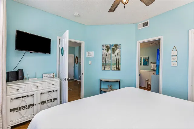 a bathroom with a sink mirror and toilet