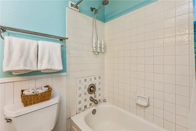 a kitchen with stainless steel appliances granite countertop a refrigerator and a stove