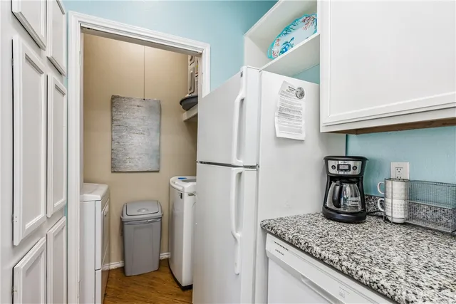 a bathroom with a toilet a sink and a mirror