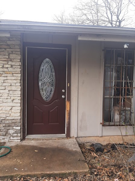 4716 Greenridge Terrace Austin, TX 78745 - Photo 1 of 1 a wooden door with a sign