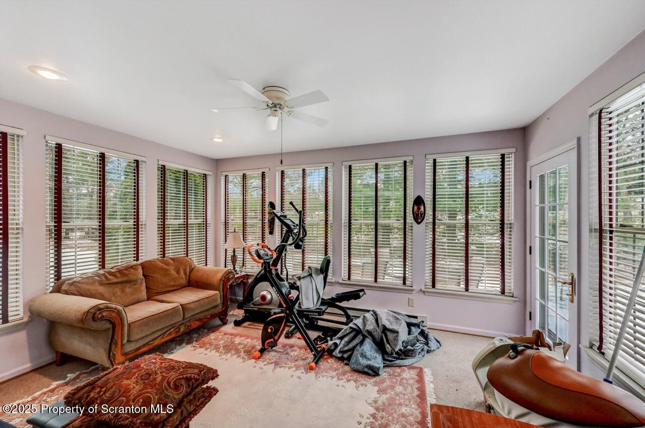 20 Hedge Row Run Clarks Summit, PA 18411 - Photo 20 of 66 a living room with furniture and floor to ceiling windows