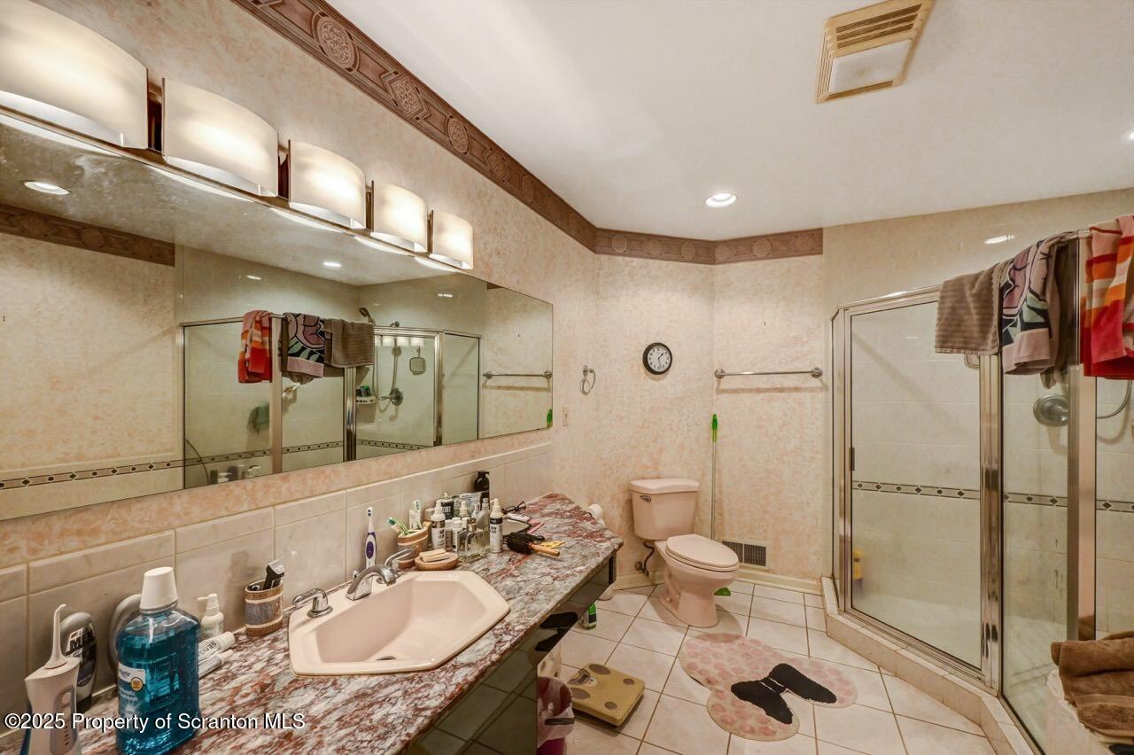 20 Hedge Row Run Clarks Summit, PA 18411 - Photo 27 of 66 a bathroom with a sink mirror and toilet