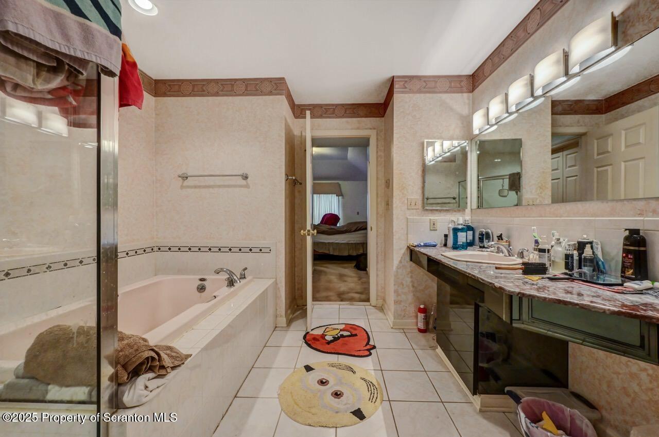 20 Hedge Row Run Clarks Summit, PA 18411 - Photo 28 of 66 a bathroom with a tub sink and mirror