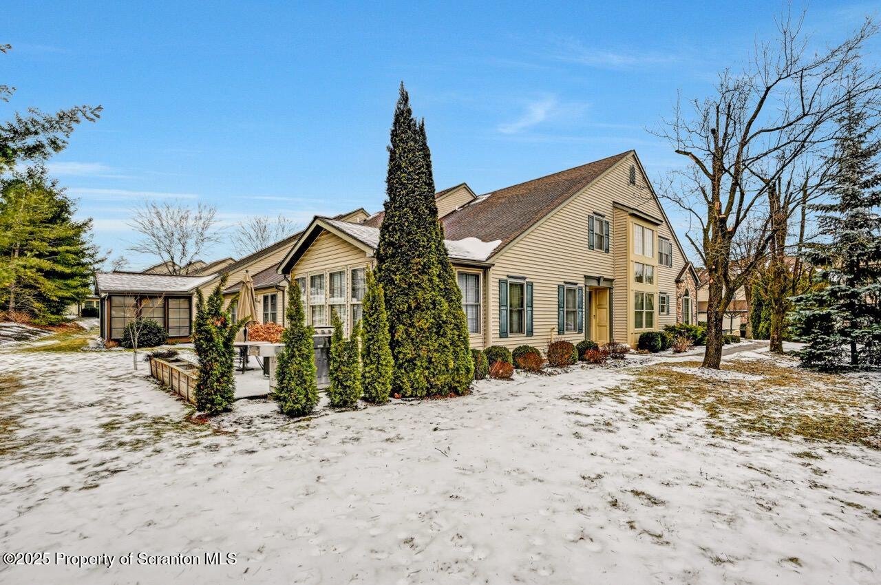 20 Hedge Row Run Clarks Summit, PA 18411 - Photo 30 of 66 a view of a blue house with a yard covered with snow
