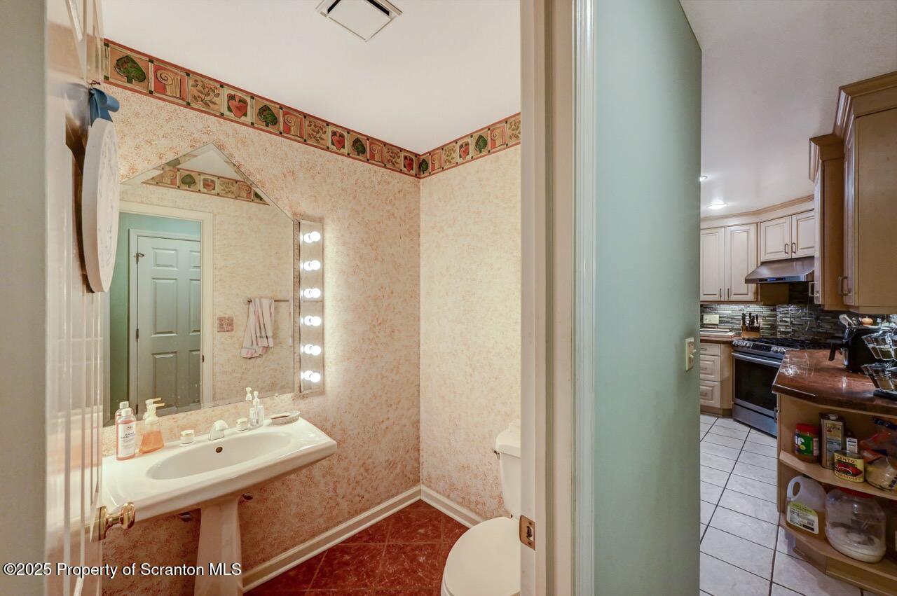 20 Hedge Row Run Clarks Summit, PA 18411 - Photo 40 of 66 a bathroom with a sink a toilet and a mirror