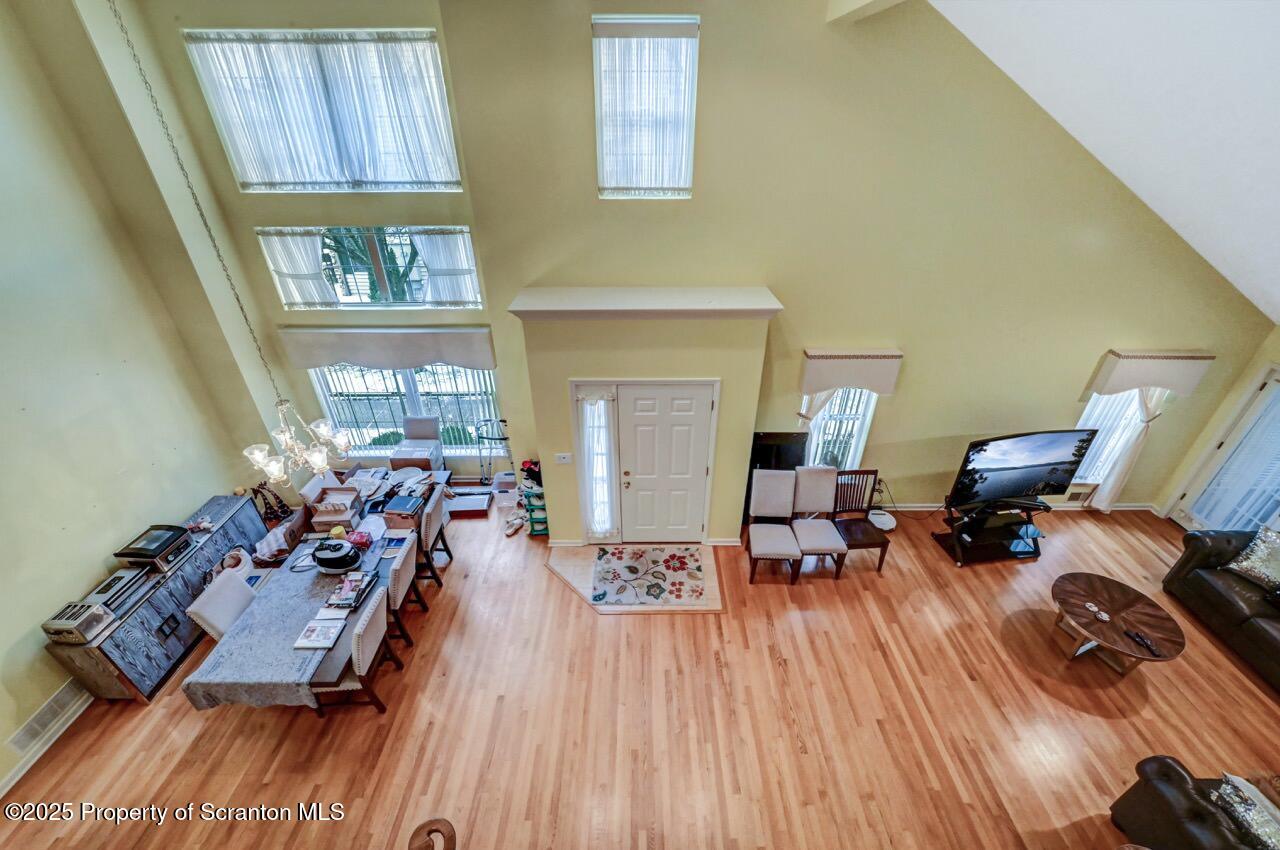 20 Hedge Row Run Clarks Summit, PA 18411 - Photo 46 of 66 a living room with furniture and a wooden floor