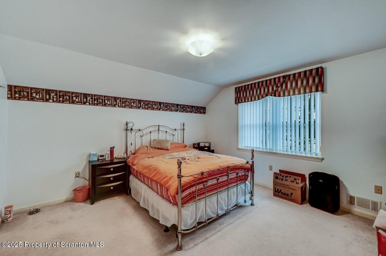 20 Hedge Row Run Clarks Summit, PA 18411 - Photo 49 of 66 a bedroom with a bed and a potted plant on dresser