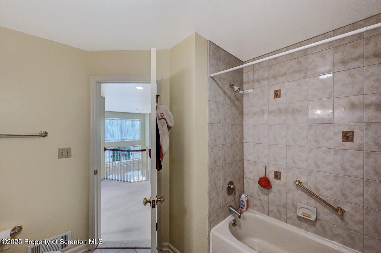 20 Hedge Row Run Clarks Summit, PA 18411 - Photo 53 of 66 a bathroom with a tub and shower