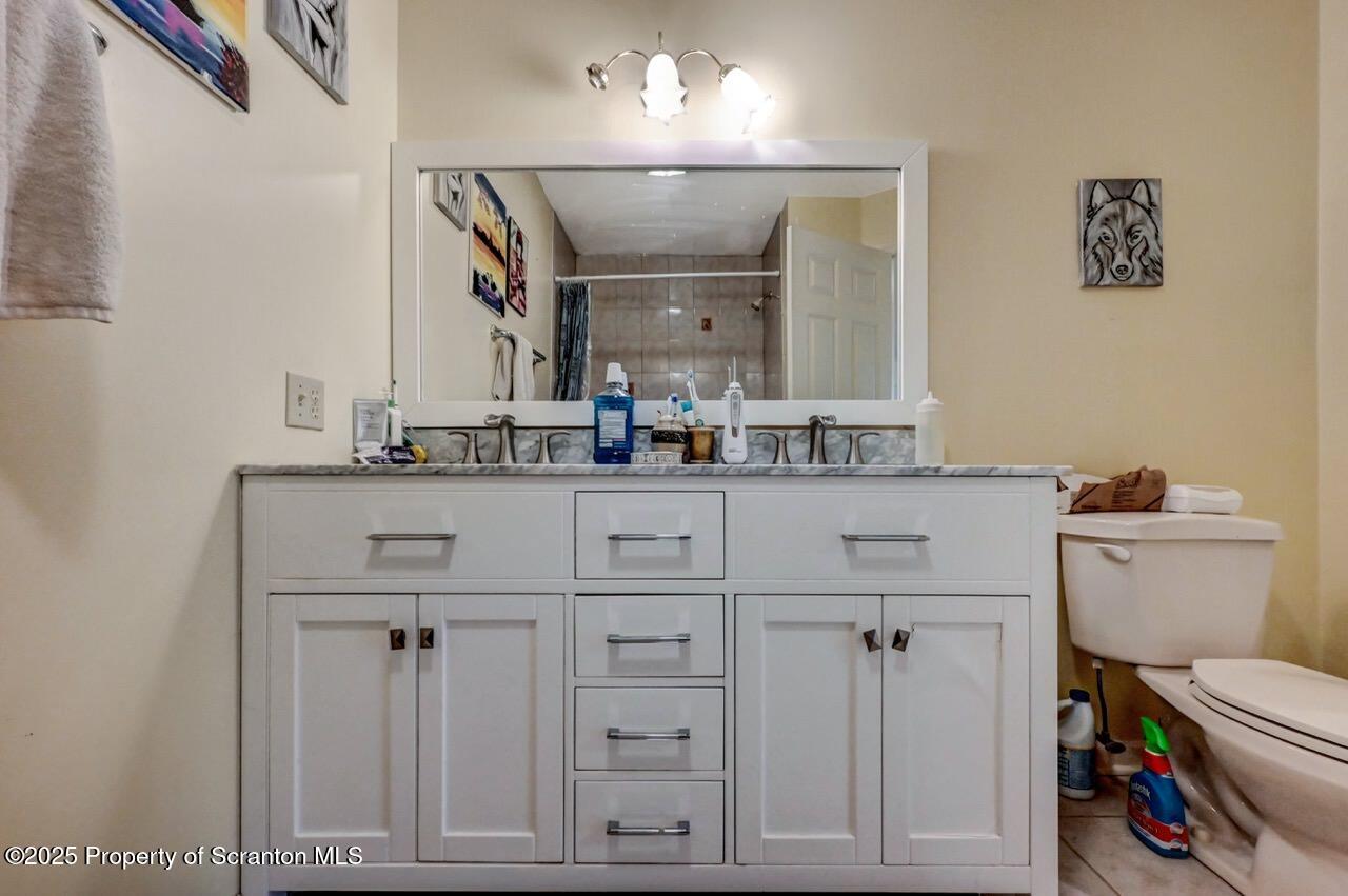 20 Hedge Row Run Clarks Summit, PA 18411 - Photo 54 of 66 a bathroom with a sink a toilet and a mirror