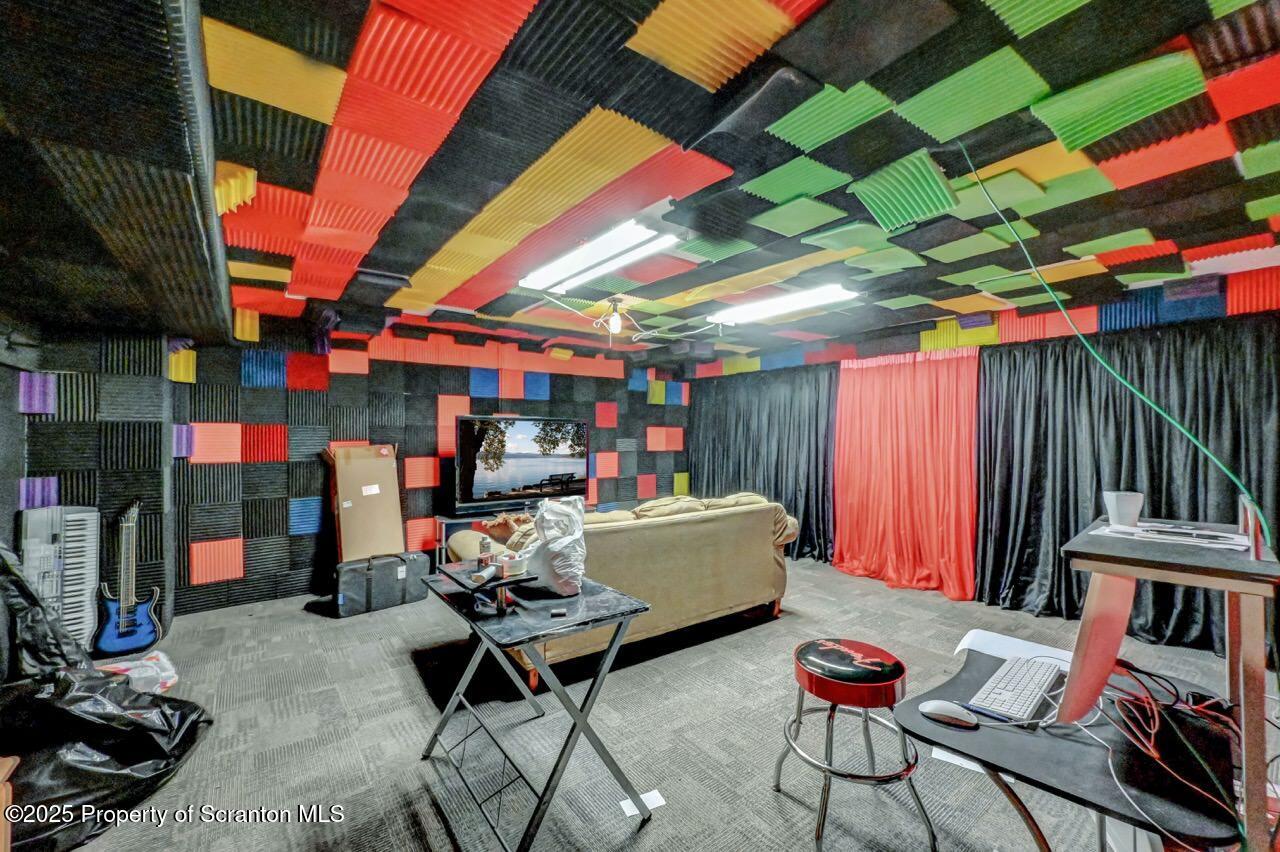 20 Hedge Row Run Clarks Summit, PA 18411 - Photo 58 of 66 a living room with patio furniture and a fireplace