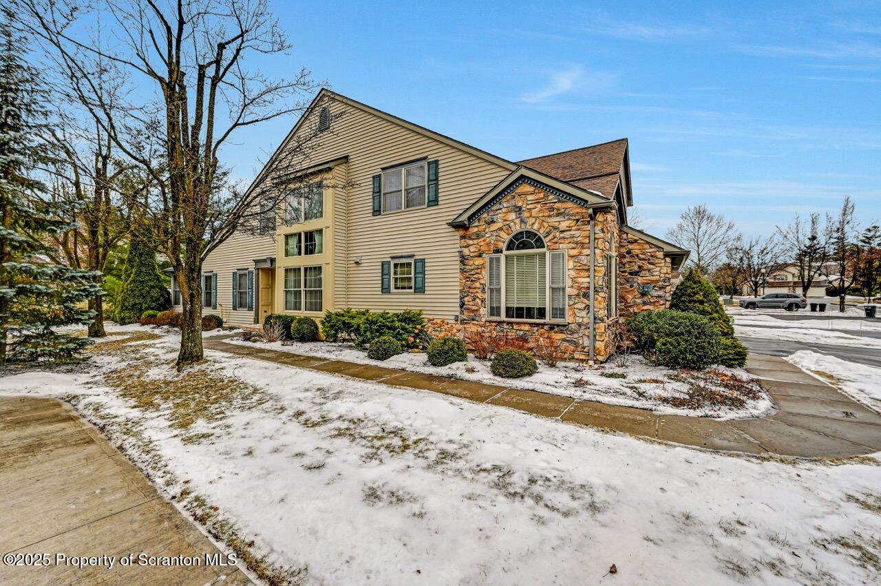20 Hedge Row Run Clarks Summit, PA 18411 - Photo 65 of 66 a front view of a house with a dirt yard and a large tree