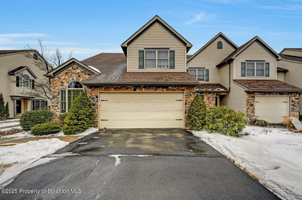 20 Hedge Row Run Clarks Summit, PA 18411 - Photo 66 of 66 a front view of a house with a yard and garage