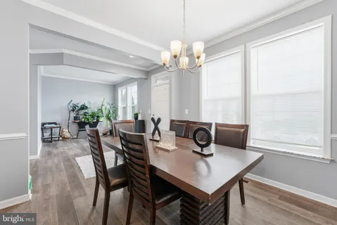 a view of a dining room with furniture and window