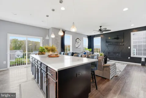 a view of kitchen island a sink and living room