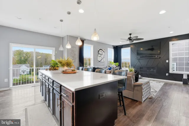 a view of kitchen island a sink and living room