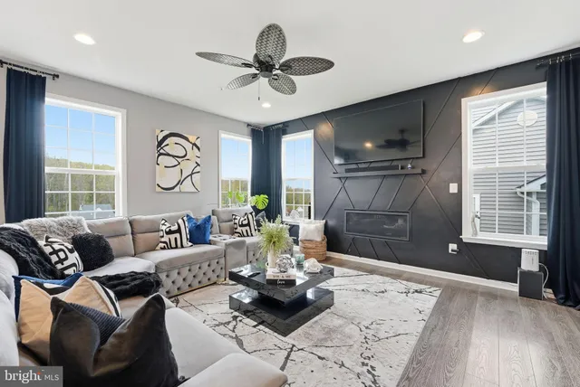 a living room with furniture and a large window