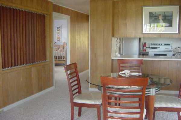 151 Manulele Street Hilo, HI 96720 - Photo 2 of 4 a room with a table and chairs
