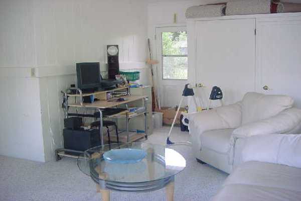 151 Manulele Street Hilo, HI 96720 - Photo 3 of 4 a living room with furniture and a window