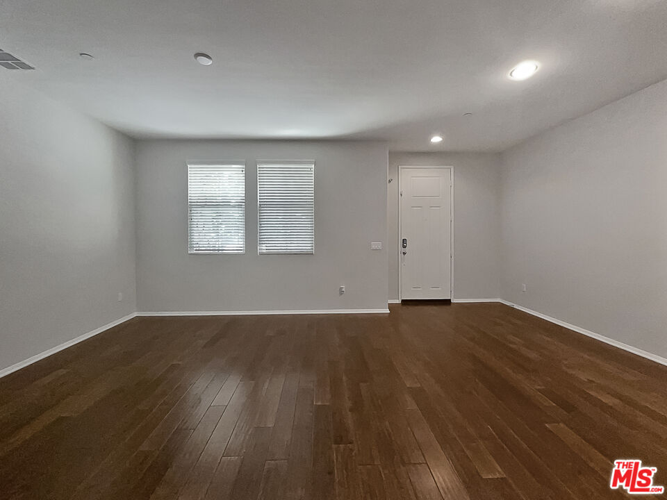 2234 Winifred Street, Unit 3 Simi Valley, CA 93063 - Photo 11 of 21 an empty room with wooden floor and windows