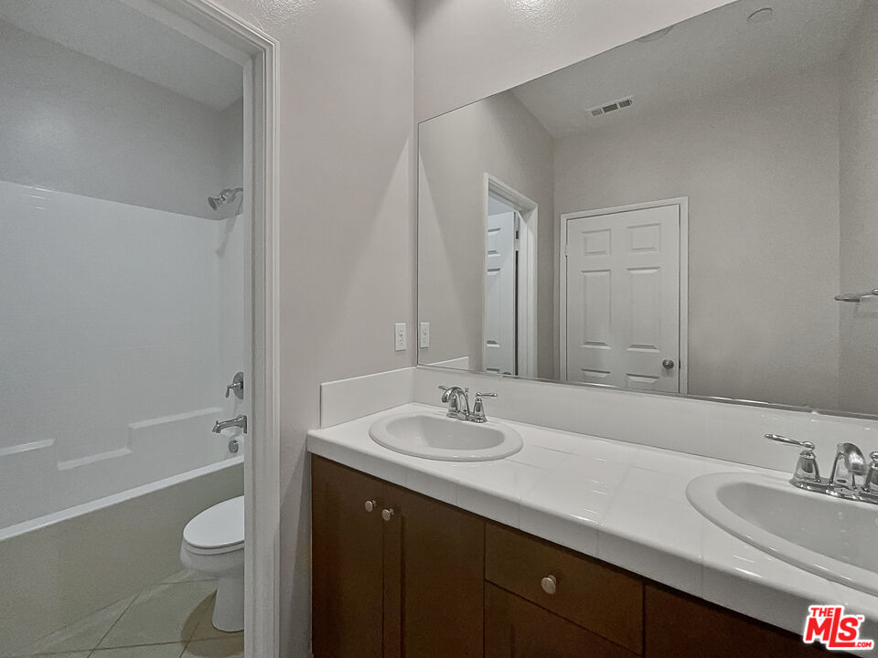 2234 Winifred Street, Unit 3 Simi Valley, CA 93063 - Photo 18 of 21 a bathroom with a granite countertop sink toilet and shower