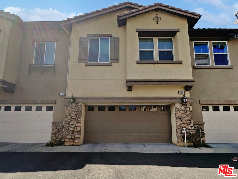 2234 Winifred Street, Unit 3 Simi Valley, CA 93063 - Photo 6 of 21 a front view of a house with lots of windows