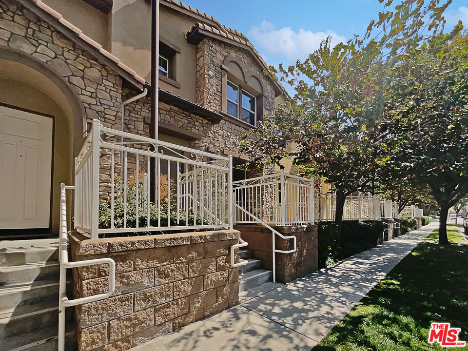 2234 Winifred Street, Unit 3 Simi Valley, CA 93063 - Photo 7 of 21 a view of a building with a bench