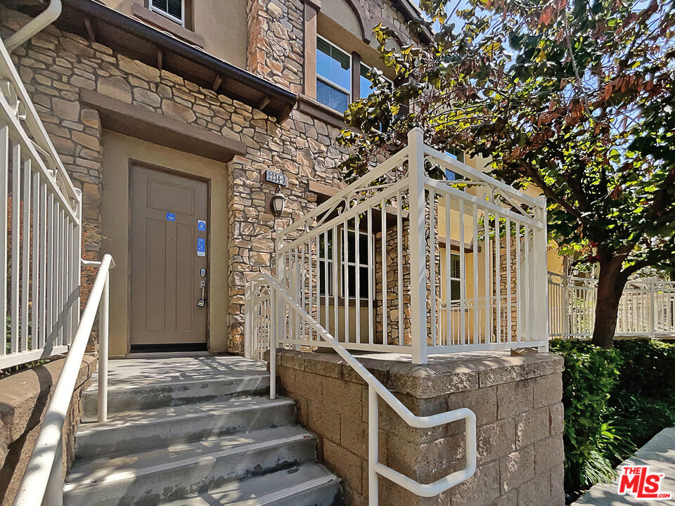 2234 Winifred Street, Unit 3 Simi Valley, CA 93063 - Photo 8 of 21 a front view of a house with a yard