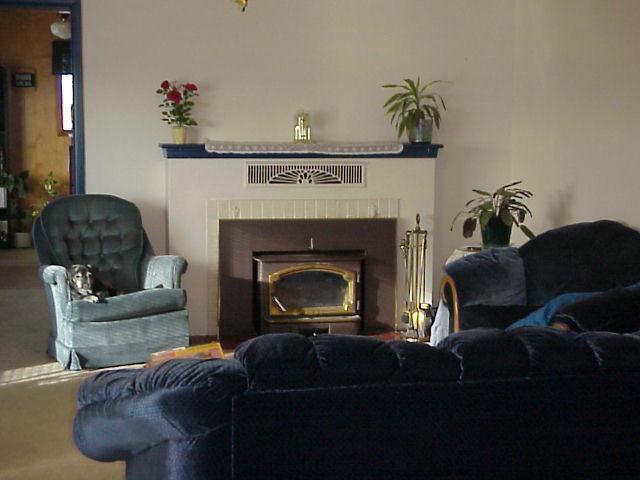3331 Olmstead Road Grandview, WA 98930 - Photo 3 of 9 a living room with furniture and a fireplace