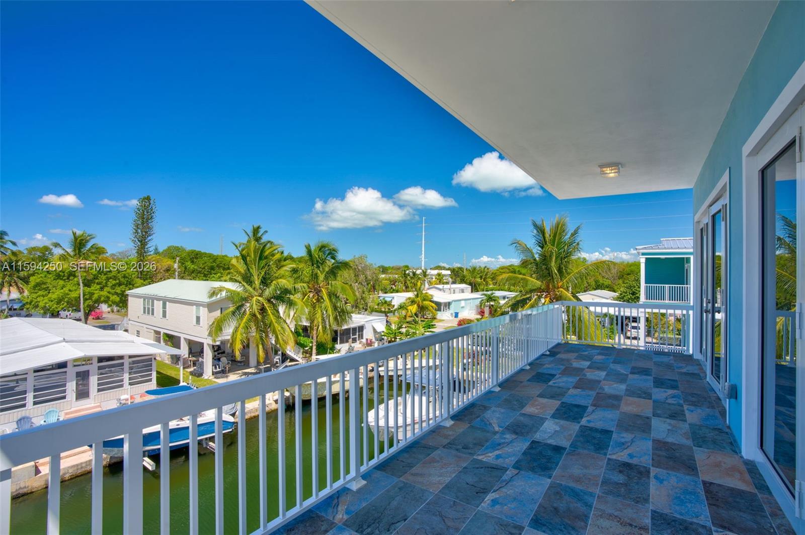 84 Coral Way Key Largo, FL 33037 - Photo 32 of 55 a view of a house with a porch