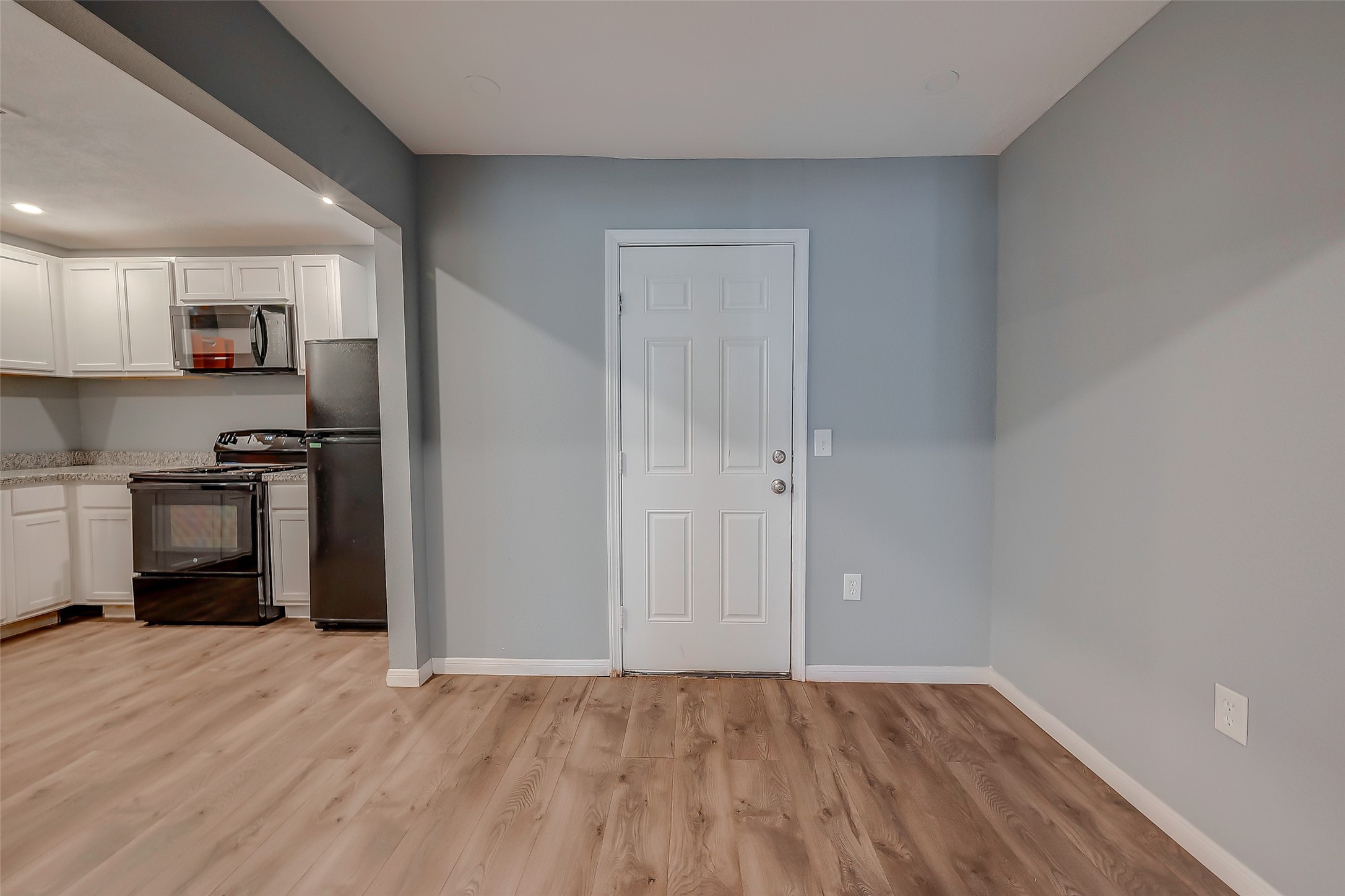 6823 Goforth Street Houston, TX 77021 - Photo 8 of 29 a view of kitchen with wooden floor and electronic appliances