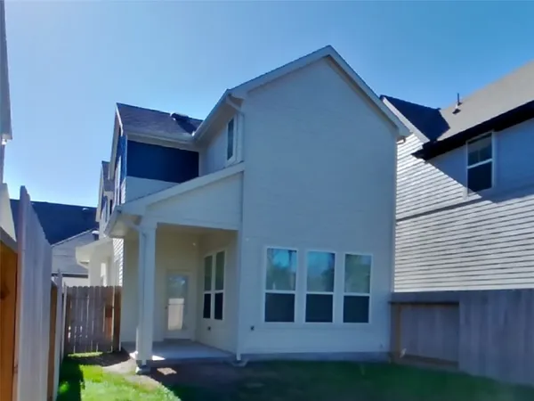 a view of a house with backyard porch and wooden floor
