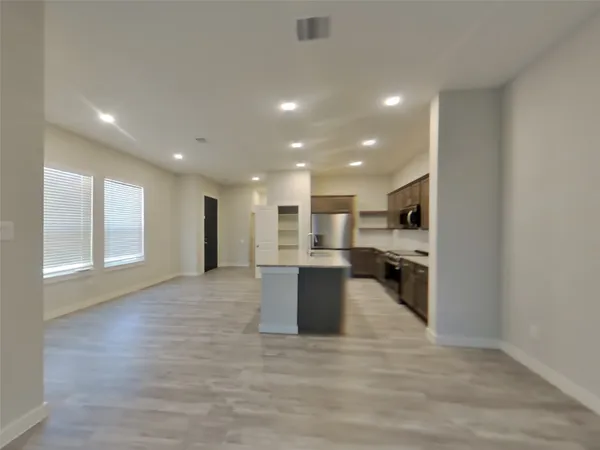 a view of a large kitchen with a sink