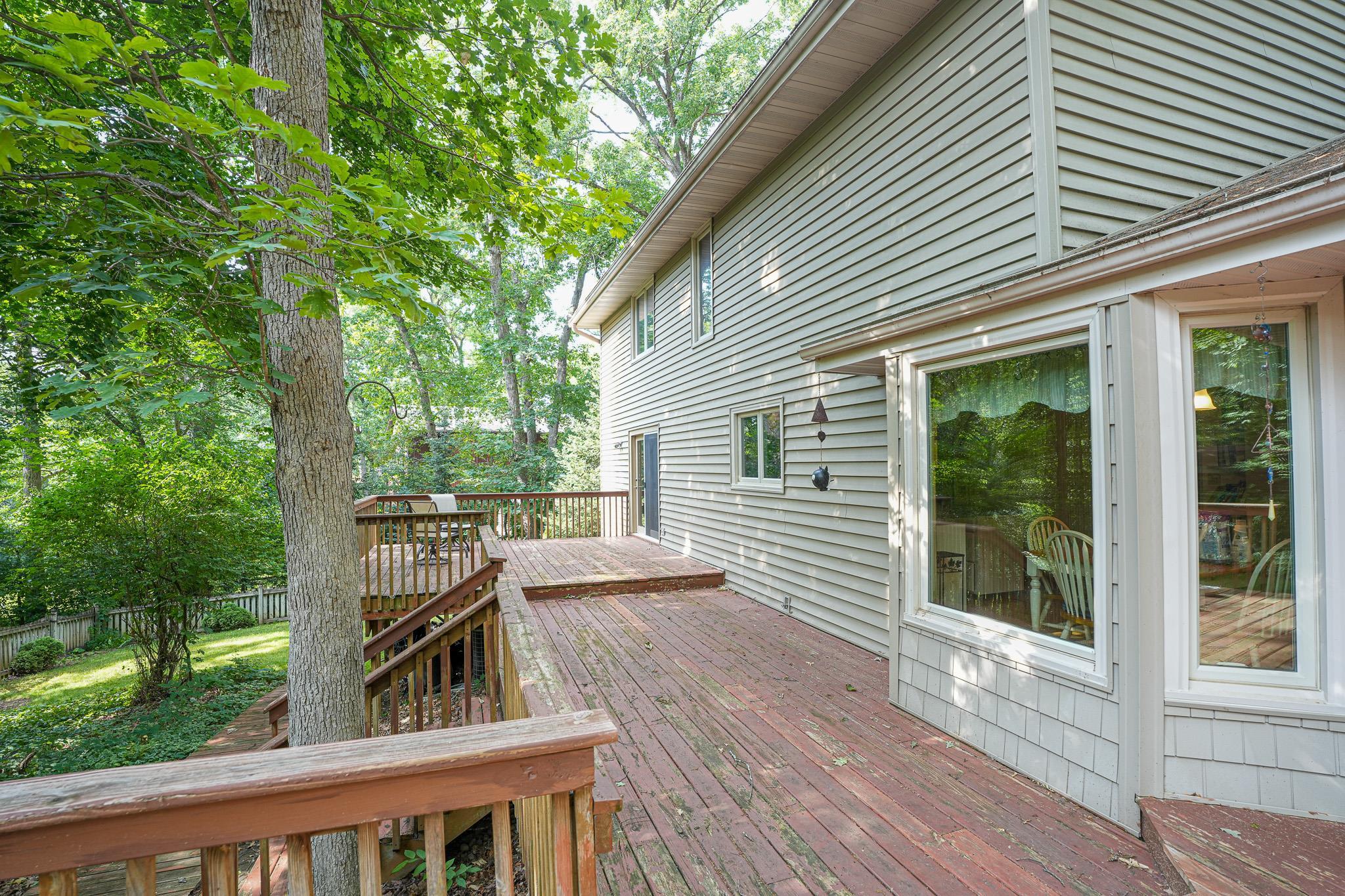 10340 William Trail Roscoe, IL 61073 - Photo 19 of 27 a view of backyard with deck and outdoor seating