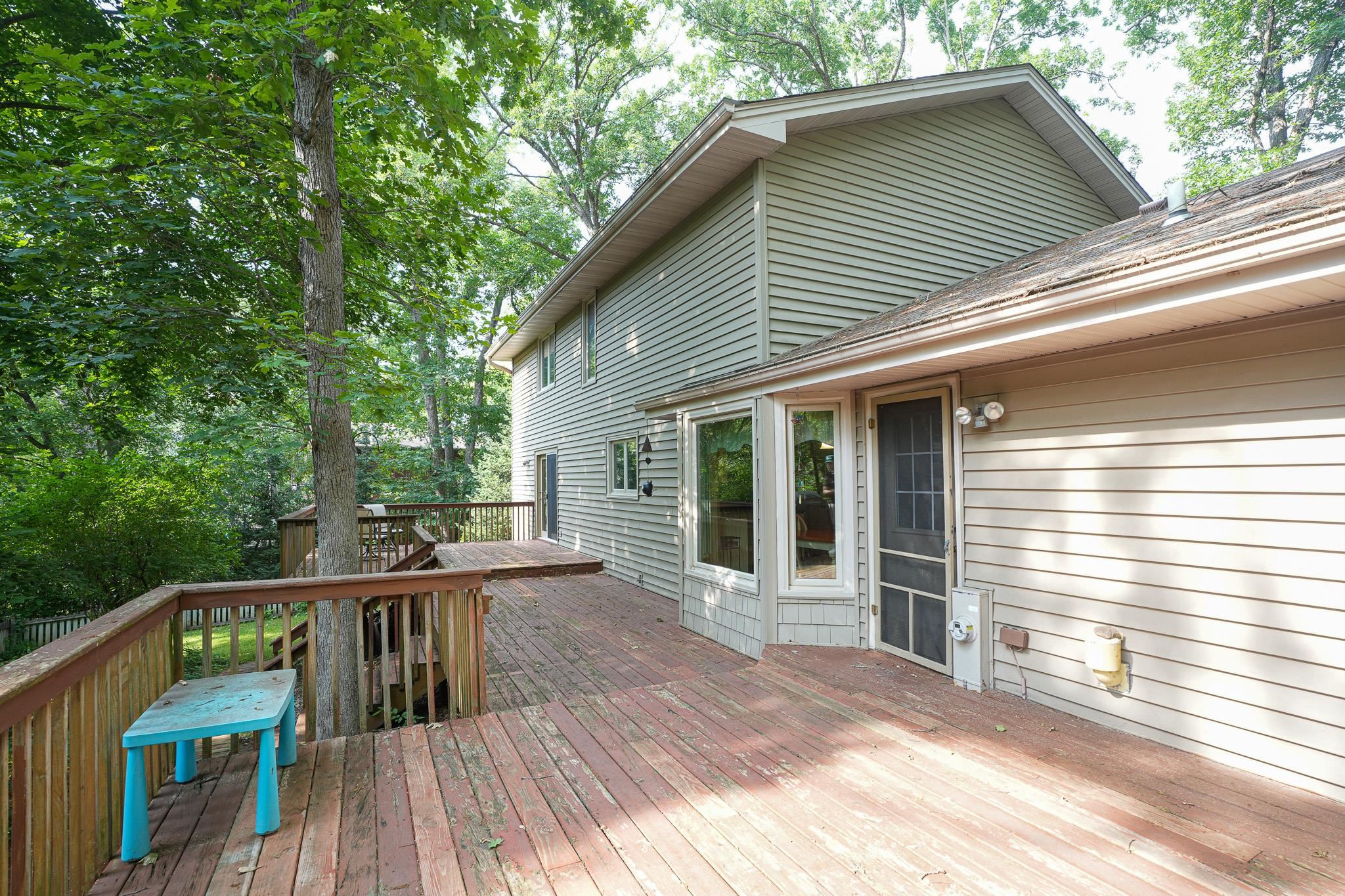 10340 William Trail Roscoe, IL 61073 - Photo 20 of 27 a view of a roof deck with wooden floor and fence next to a yard