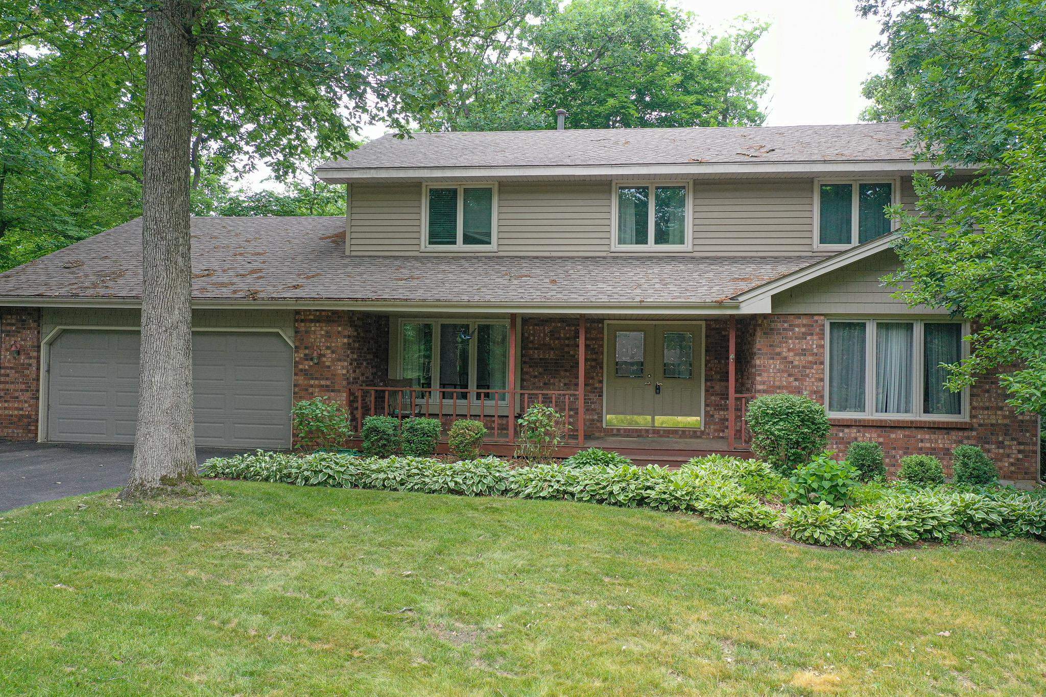 10340 William Trail Roscoe, IL 61073 - Photo 5 of 27 front view of a house with a yard