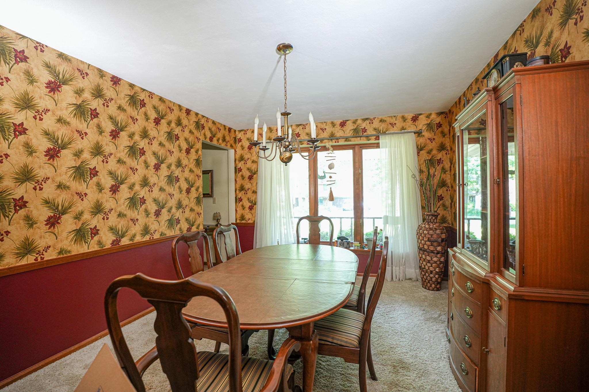10340 William Trail Roscoe, IL 61073 - Photo 10 of 27 a view of a dining room with furniture and window