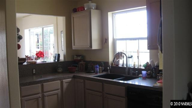 15075 Gooding Drive Reno, NV 89508 - Photo 2 of 9 a kitchen with a sink cabinets and window