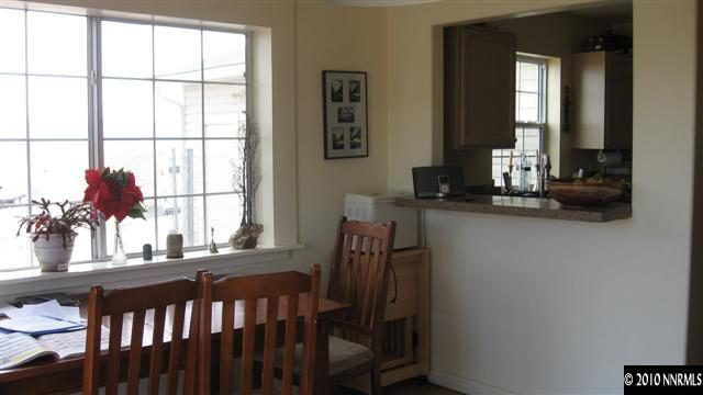 15075 Gooding Drive Reno, NV 89508 - Photo 3 of 9 a dining room with furniture and window