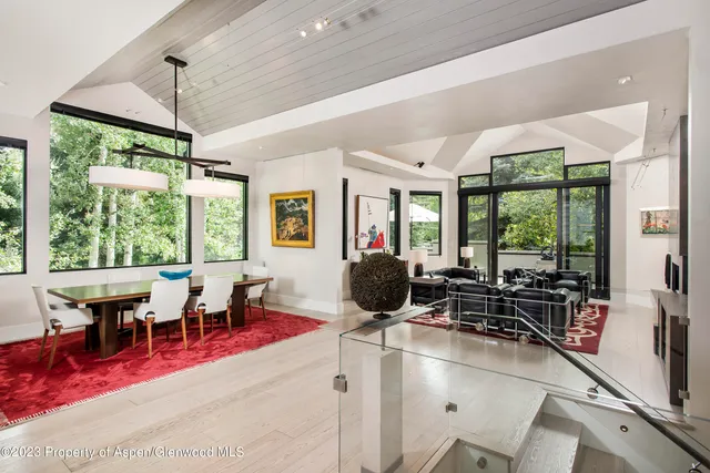 a lobby with furniture and floor to ceiling windows