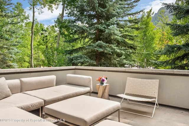 a view of a balcony with furniture