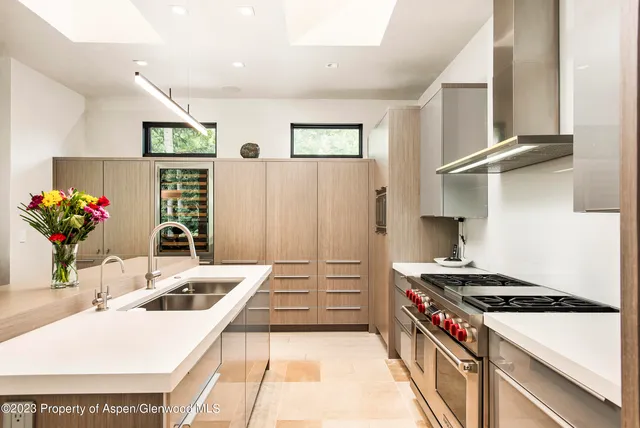 a kitchen that has a sink and a stove