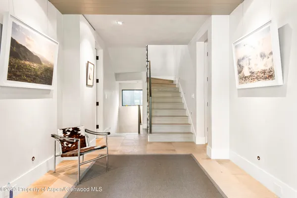 a view of a hallway with seating area