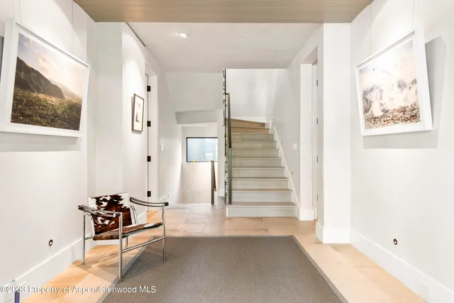 a view of a hallway with seating area