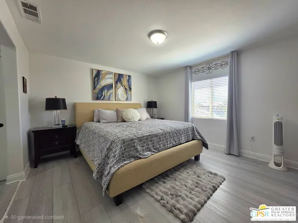 a bedroom with a bed and a couch