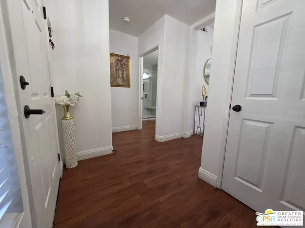 wooden floor with white walls