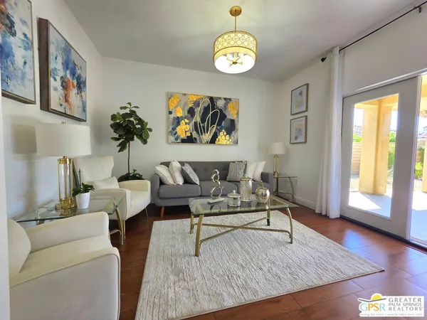 a living room with furniture and a window
