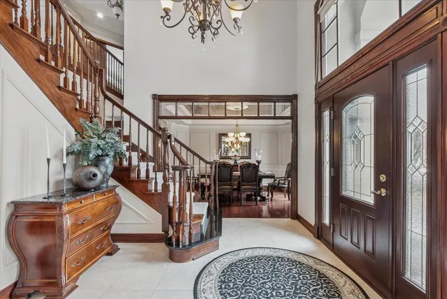 a view of entryway and hall with dining room