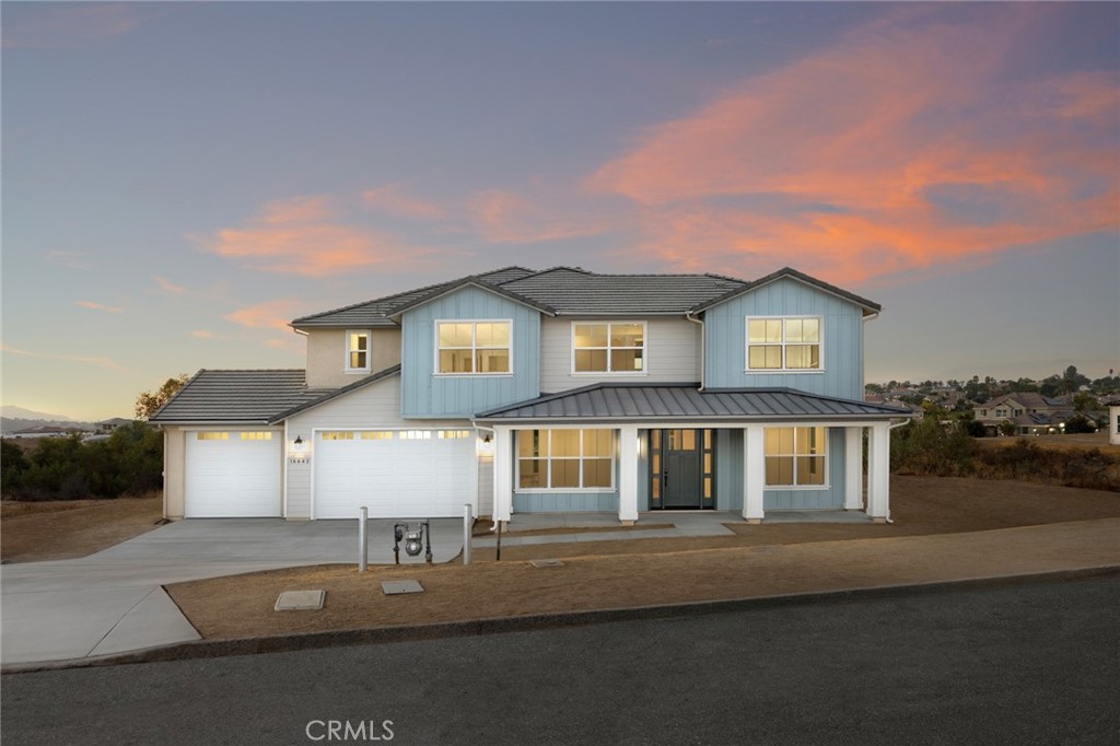 a front view of a house with garage