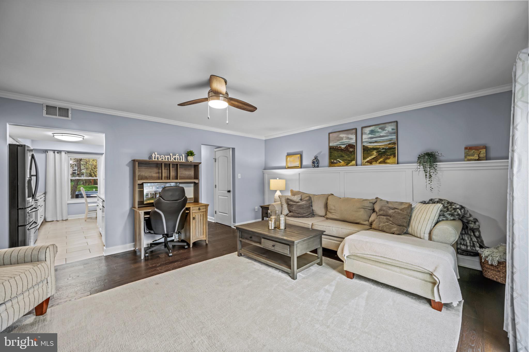 129 McKinsey Road Severna Park, MD 21146 - Photo 20 of 38 a living room with furniture and a gym cycle