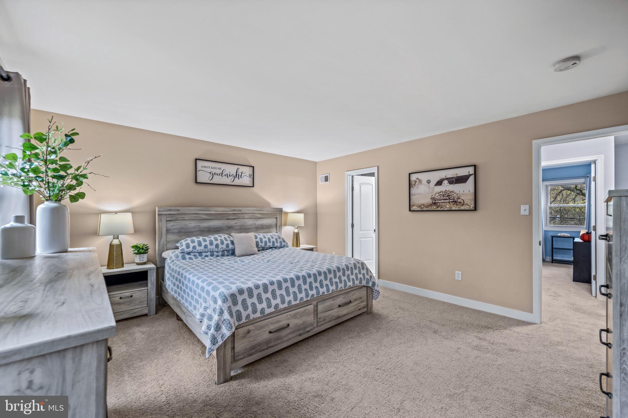 129 McKinsey Road Severna Park, MD 21146 - Photo 24 of 38 a bedroom with a bed and table chair